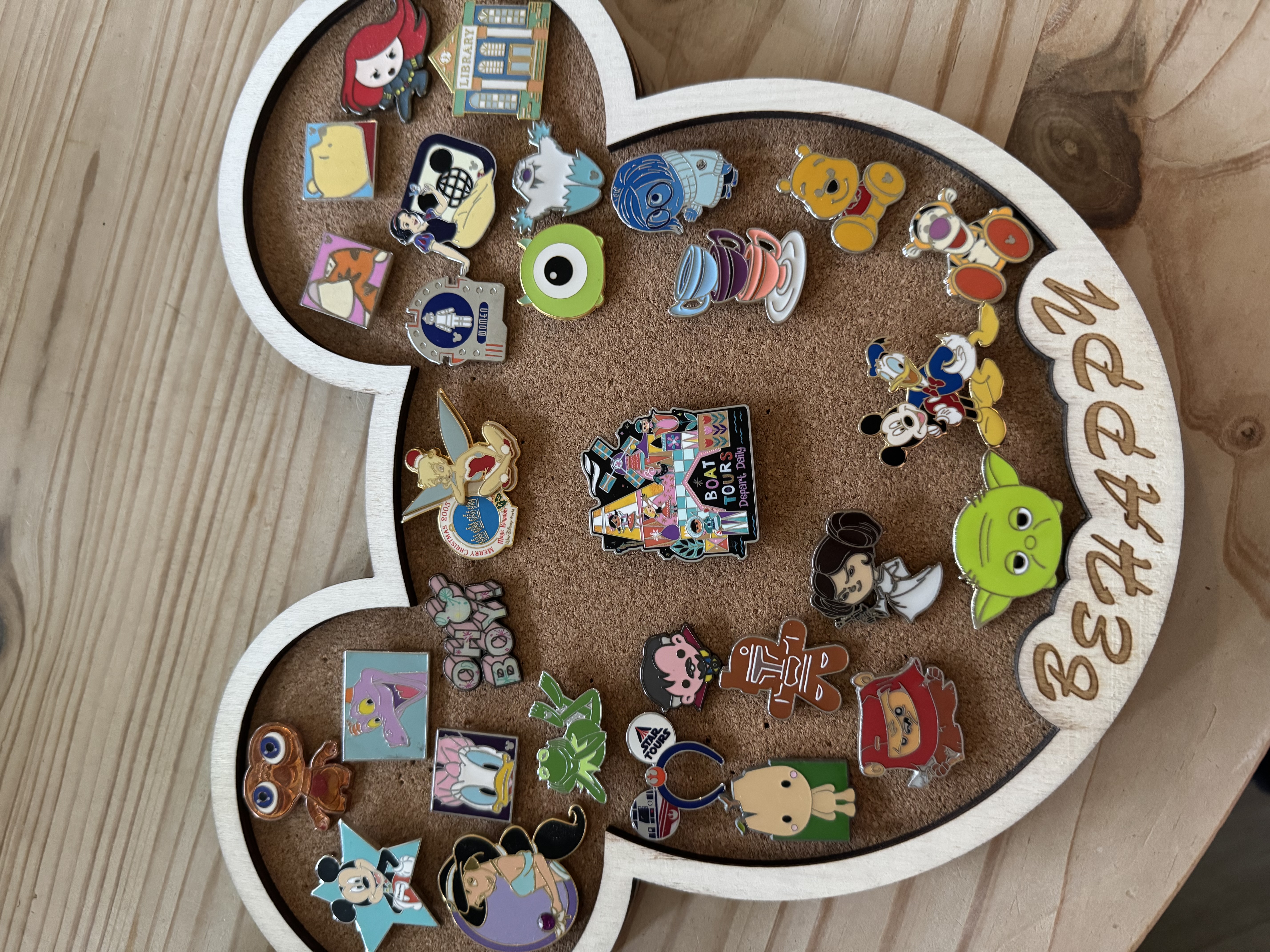 A Mickey-shaped pin trading display board