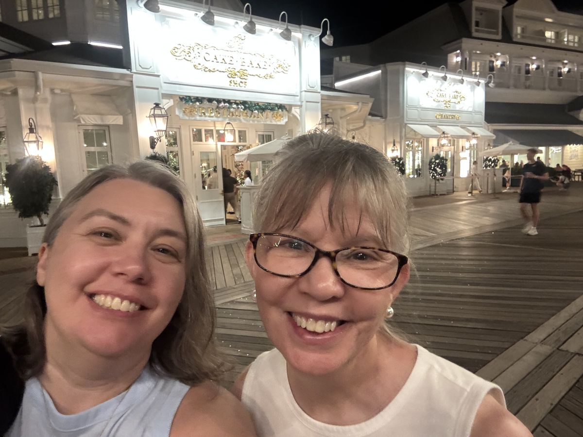 Vanessa and her mom outside Cake Bake Shop on the Boardwalk at night