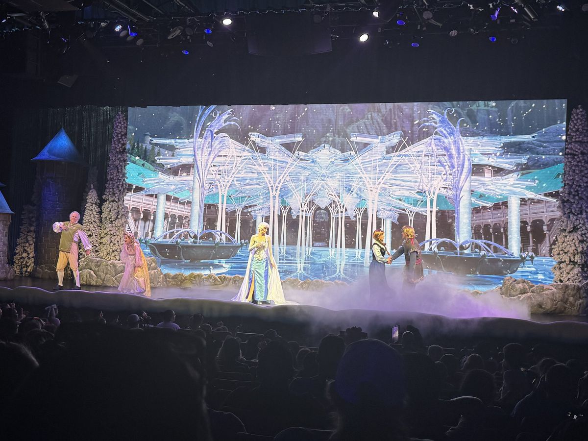 The Frozen show stage with Elsa in front of an ice palace backdrop