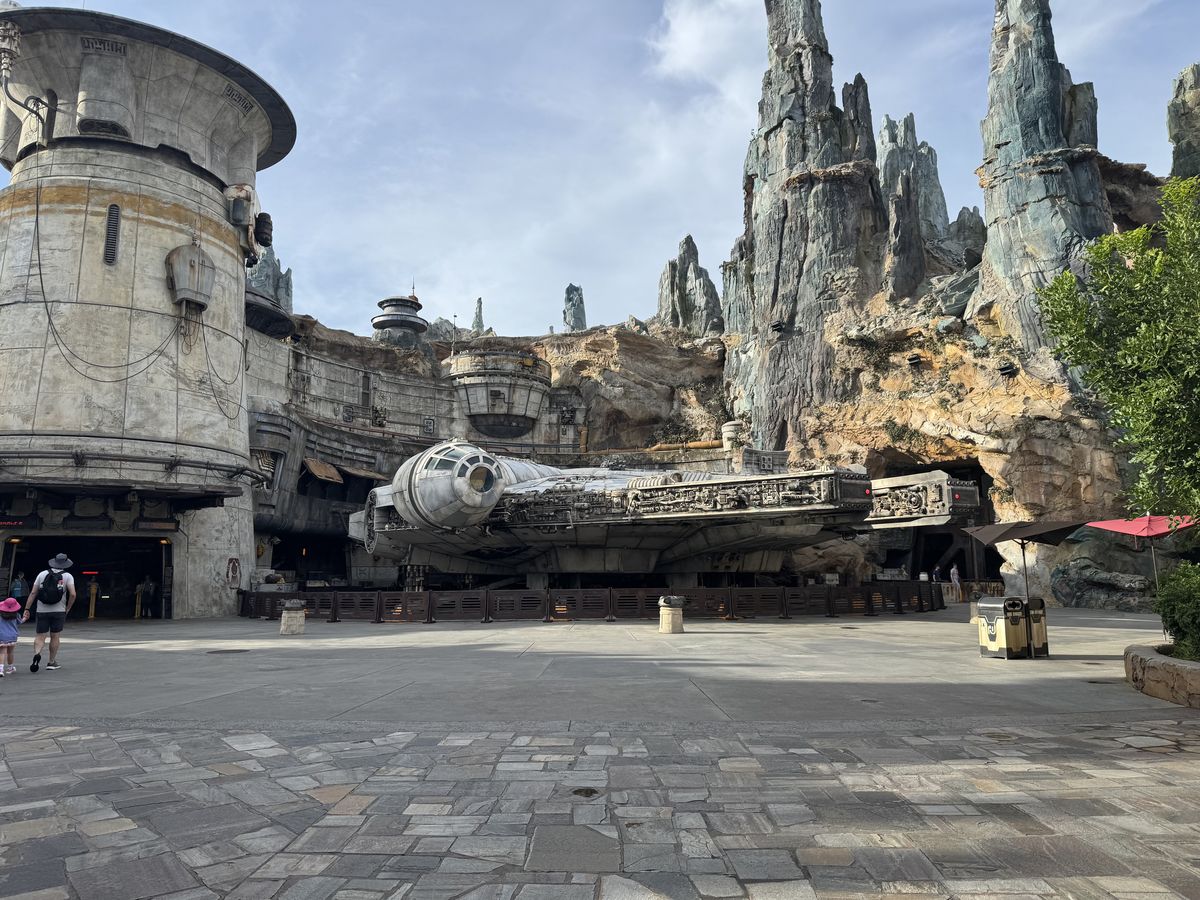 An empty Galaxys Edge with the Millennium Falcon