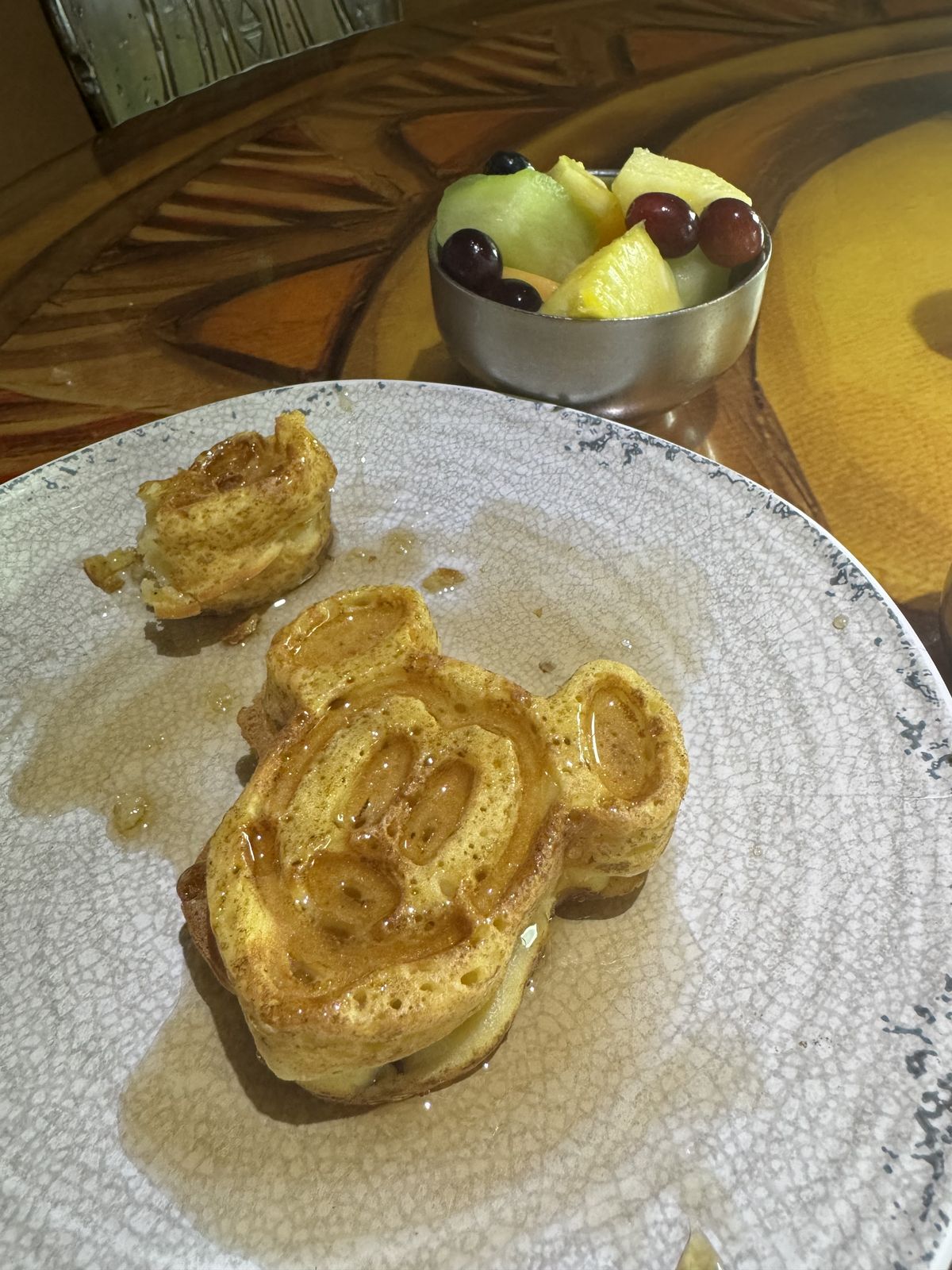 Mickey waffles with a side of fruit, moms order at Sanaa